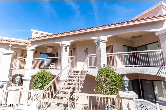 9151 West Greenway Road, Unit 239 Peoria, AZ 85381 - Photo 4 of 18 a front view of a house with a porch