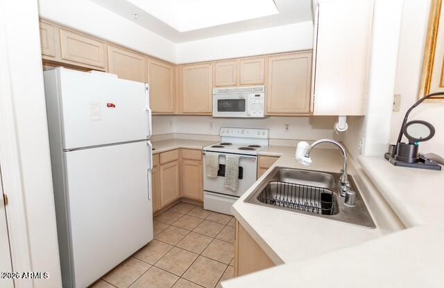 9151 West Greenway Road, Unit 239 Peoria, AZ 85381 - Photo 9 of 18 a kitchen with a refrigerator sink and stove