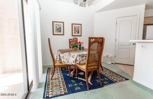 9151 West Greenway Road, Unit 239 Peoria, AZ 85381 - Photo 10 of 18 a dining room with furniture and wooden floor