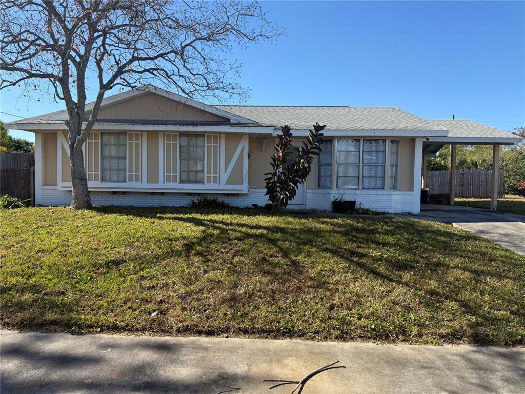 750 Hampton Drive Northeast Palm Bay, FL 32905 - Photo 2 of 8 a view of a house with a yard