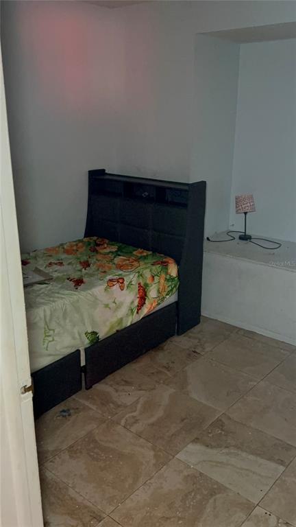 750 Hampton Drive Northeast Palm Bay, FL 32905 - Photo 8 of 8 a bed sitting in a bedroom and dressers