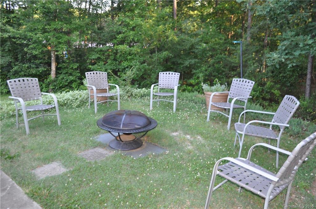 6016 Ra Austin Road Marshville, NC 28103 - Photo 10 of 13 a backyard of a house with table and chairs