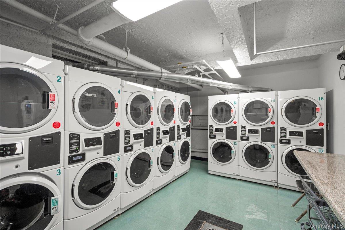 110-45 71st Road, Unit 6D Queens, NY 11375 - Photo 15 of 20 Community laundry with stacked washer and clothes dryer and washer and clothes dryer