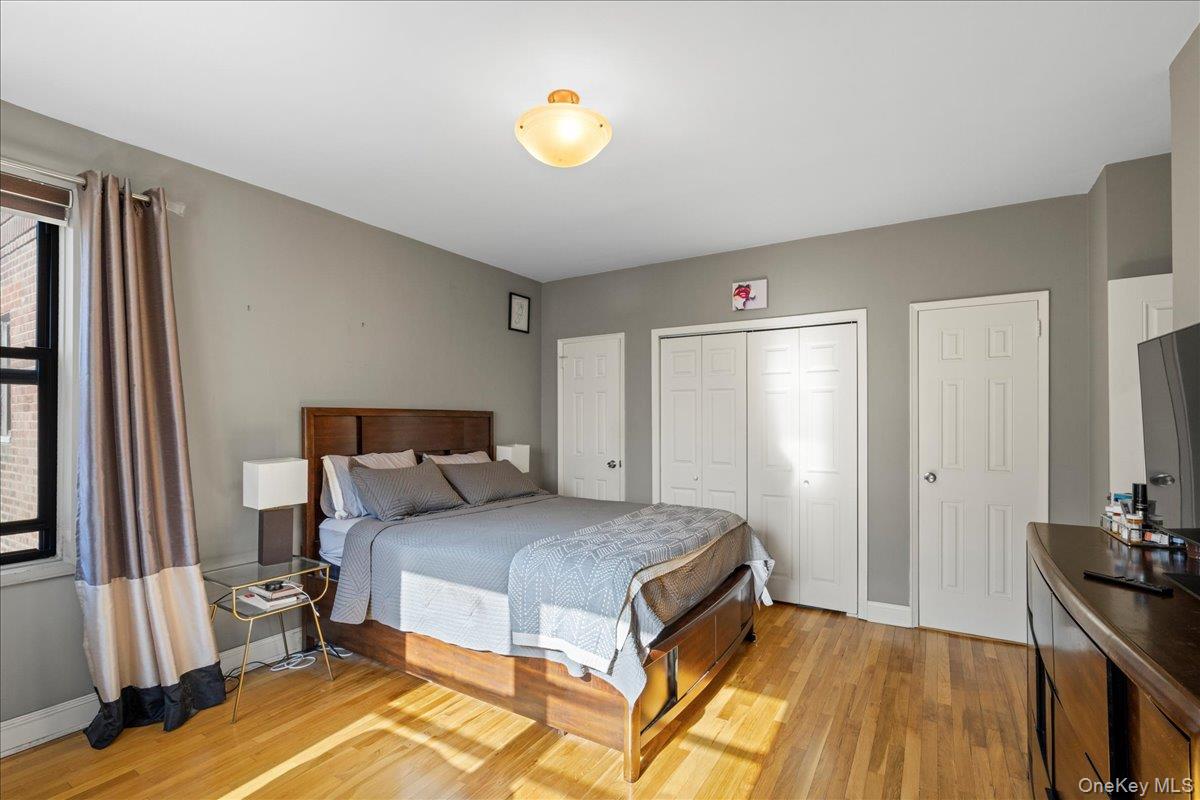 110-45 71st Road, Unit 6D Queens, NY 11375 - Photo 4 of 20 Bedroom with light wood finished floors and a closet