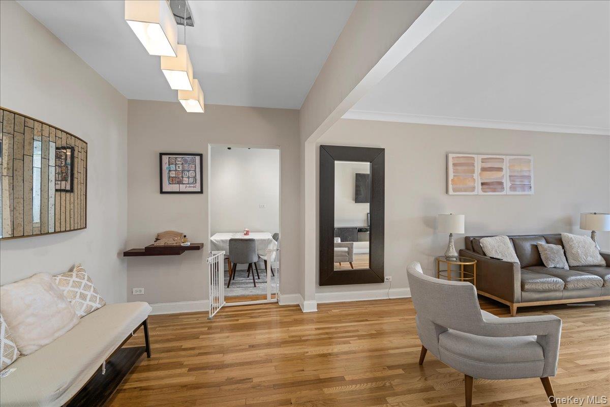 110-45 71st Road, Unit 6D Queens, NY 11375 - Photo 7 of 20 Living room featuring wood finished floors and baseboards