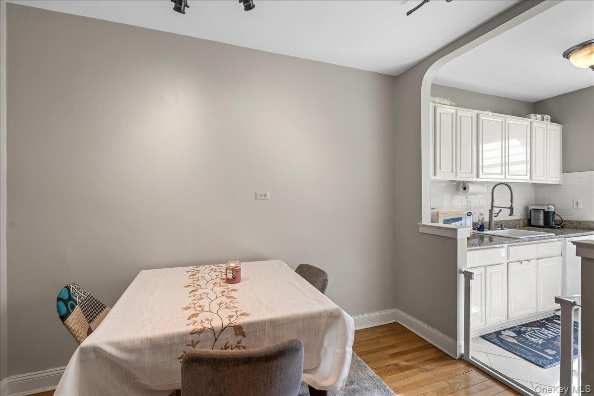110-45 71st Road, Unit 6D Queens, NY 11375 - Photo 8 of 20 Dining room featuring light wood-style floors and baseboards
