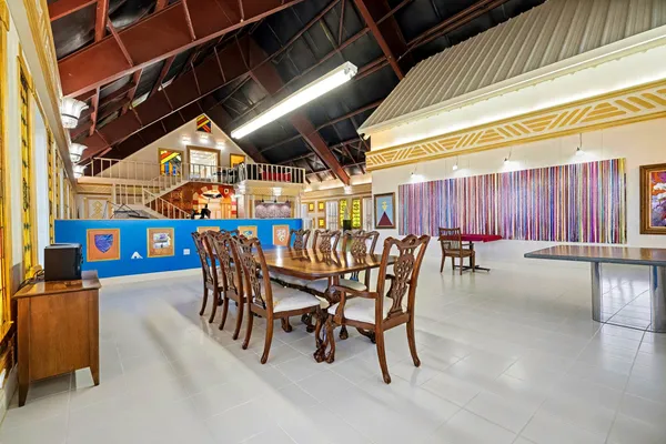 a living room with lots of furniture and a rug