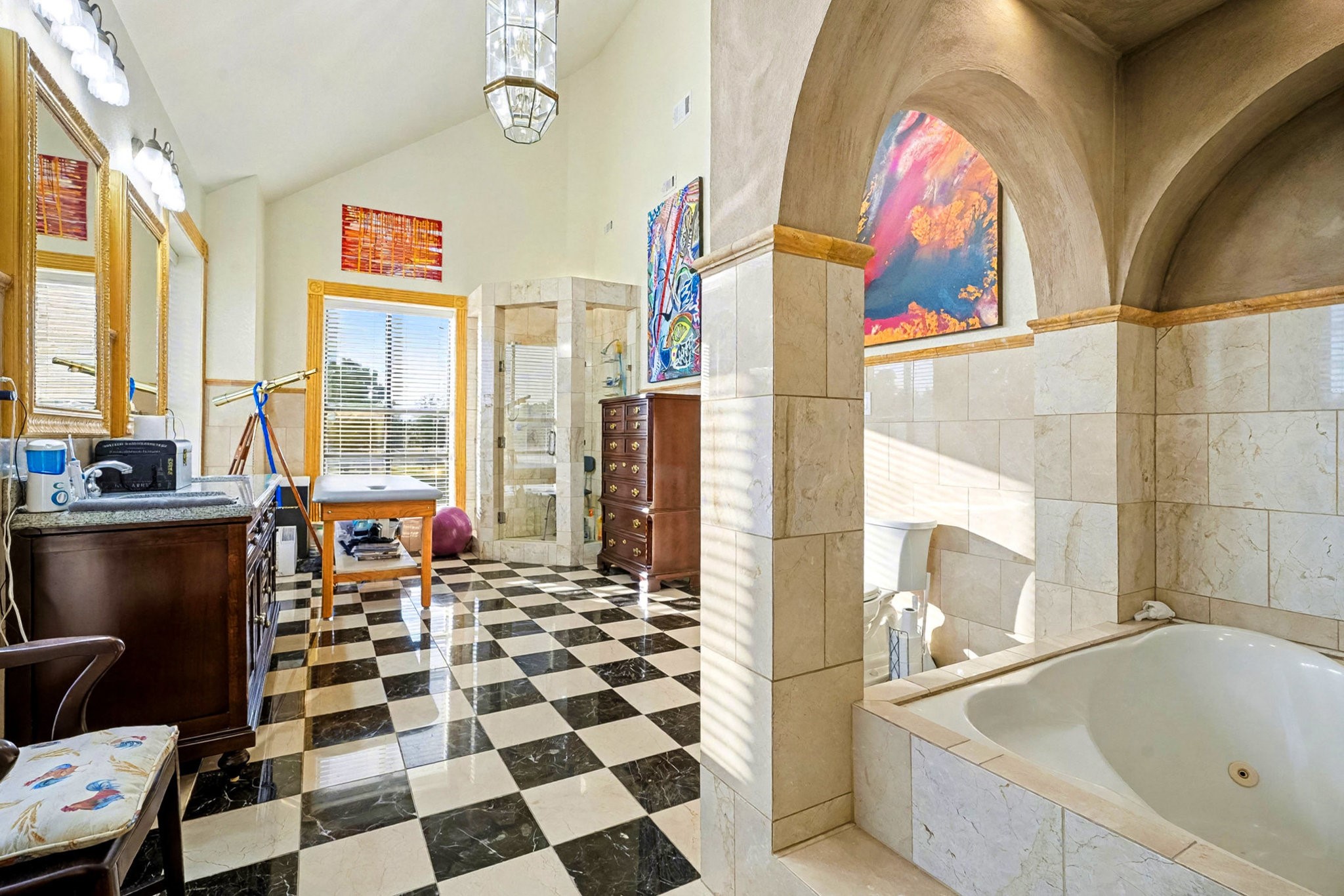 1200 Davenport Parkway Rosharon, TX 77583 - Photo 22 of 49 Bright and open bathroom retreat with artistic finishes, large windows, and classic black-
and-white tile flooring.