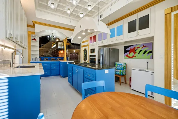 a bedroom with a bed and a view of kitchen