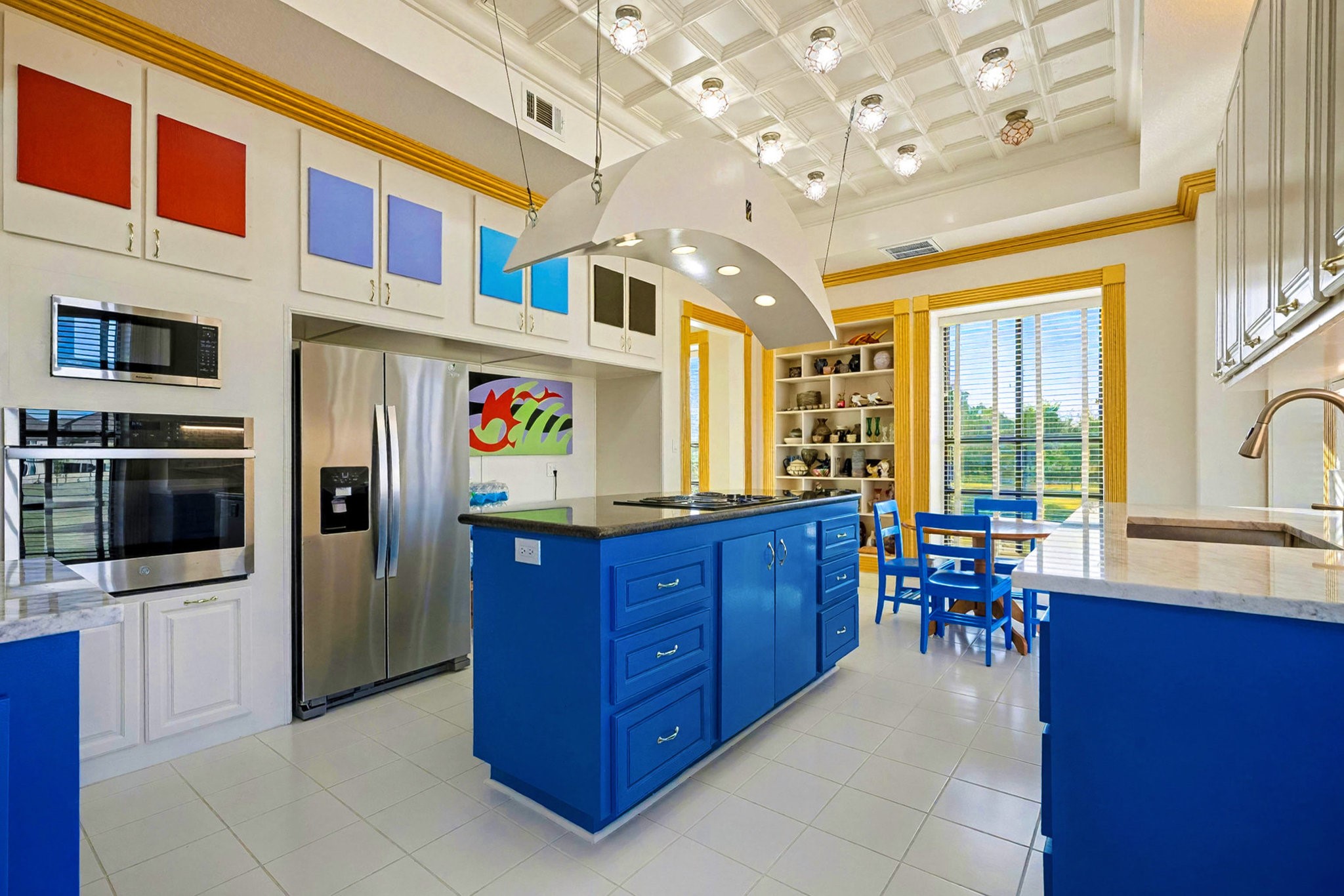 1200 Davenport Parkway Rosharon, TX 77583 - Photo 8 of 49 Contemporary kitchen featuring stainless steel appliances, marble counters, and artistic
upper-cabinet color insets for a bold design statement.
