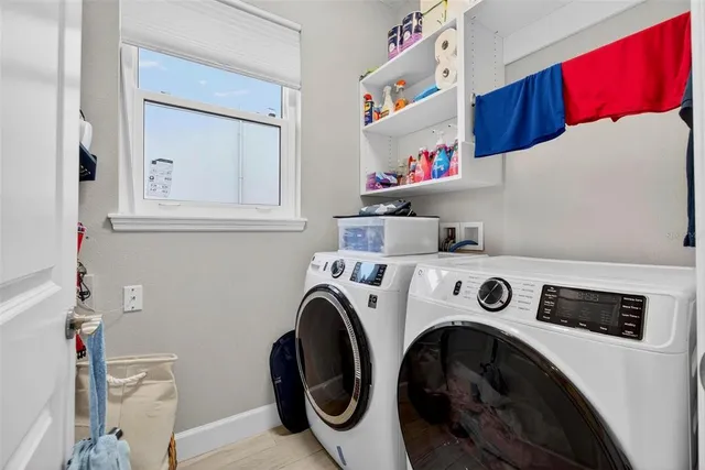 a work room with furniture and a window