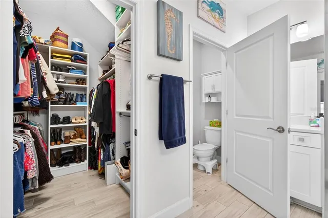 a view of a kitchen with a sink and cabinets