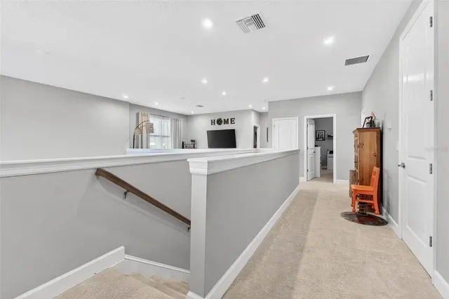 a living room with furniture white walls and white walls