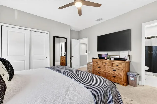 a very nice looking room with a bed furniture and a kitchen view