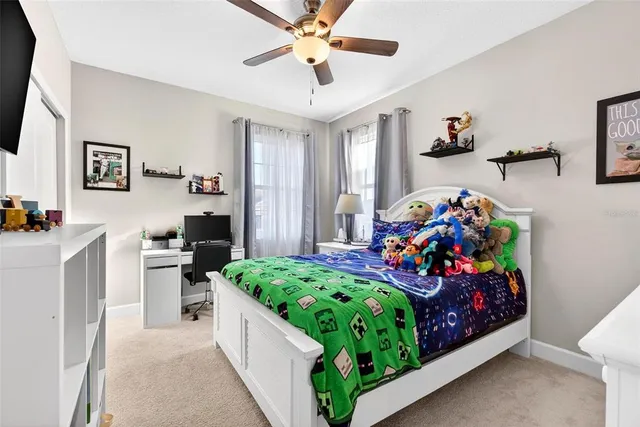 a room with furniture a rug toys and a window