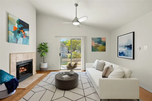 a living room with furniture and a fireplace