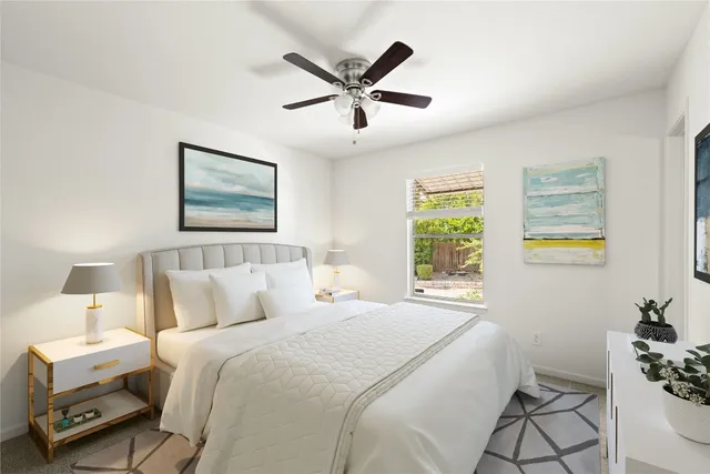 a bedroom with a bed and window