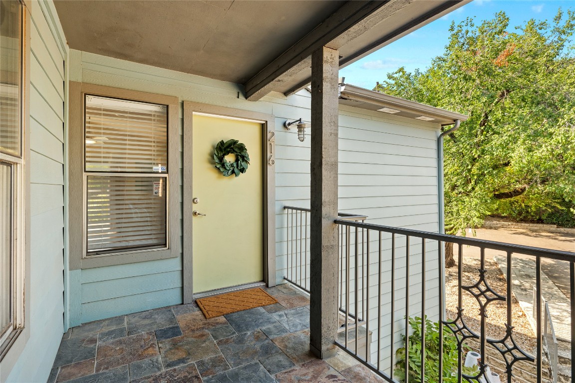 3204 Menchaca Road, Unit 216 Austin, TX 78704 - Photo 24 of 38 a view of a porch with a door and wooden floor