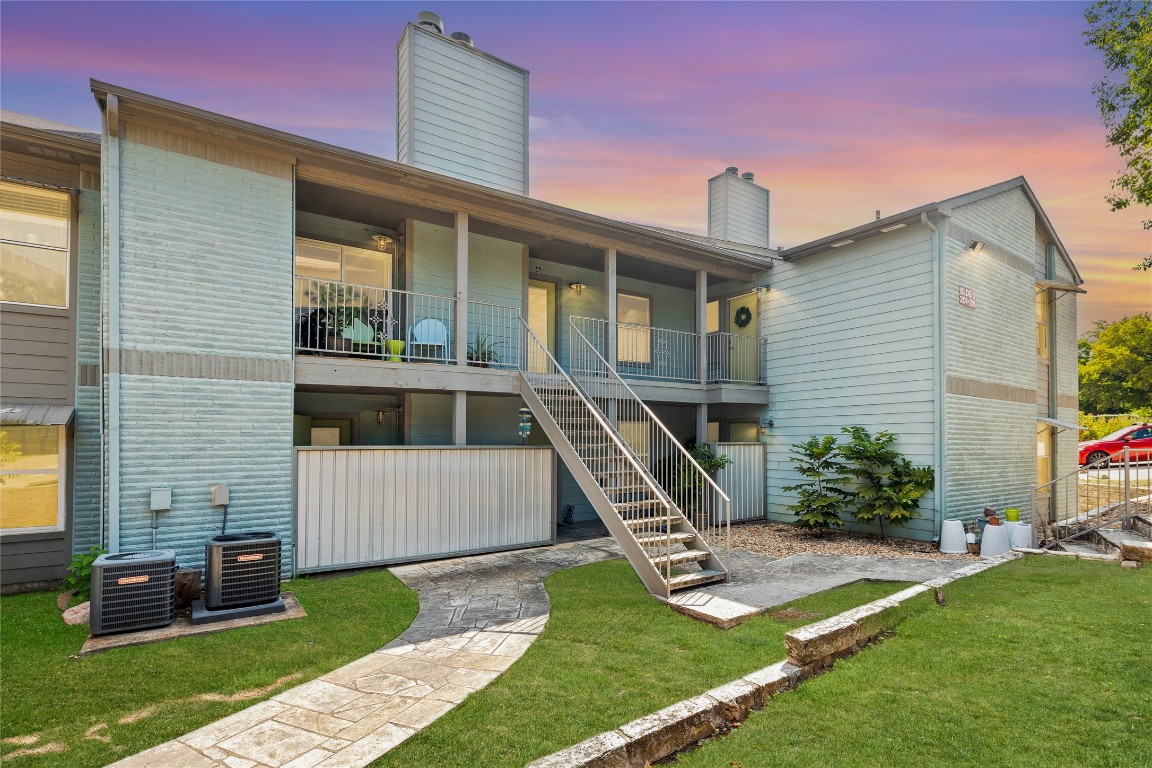 3204 Menchaca Road, Unit 216 Austin, TX 78704 - Photo 25 of 38 a front view of a house with a yard