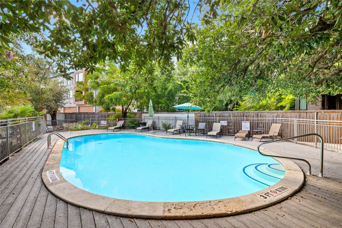 3204 Menchaca Road, Unit 216 Austin, TX 78704 - Photo 28 of 38 a view of a swimming pool with chairs