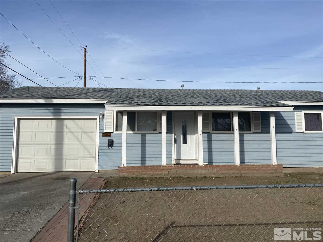 1165 Manhattan Street Reno, NV 89512 - Photo 1 of 14 a front view of a house
