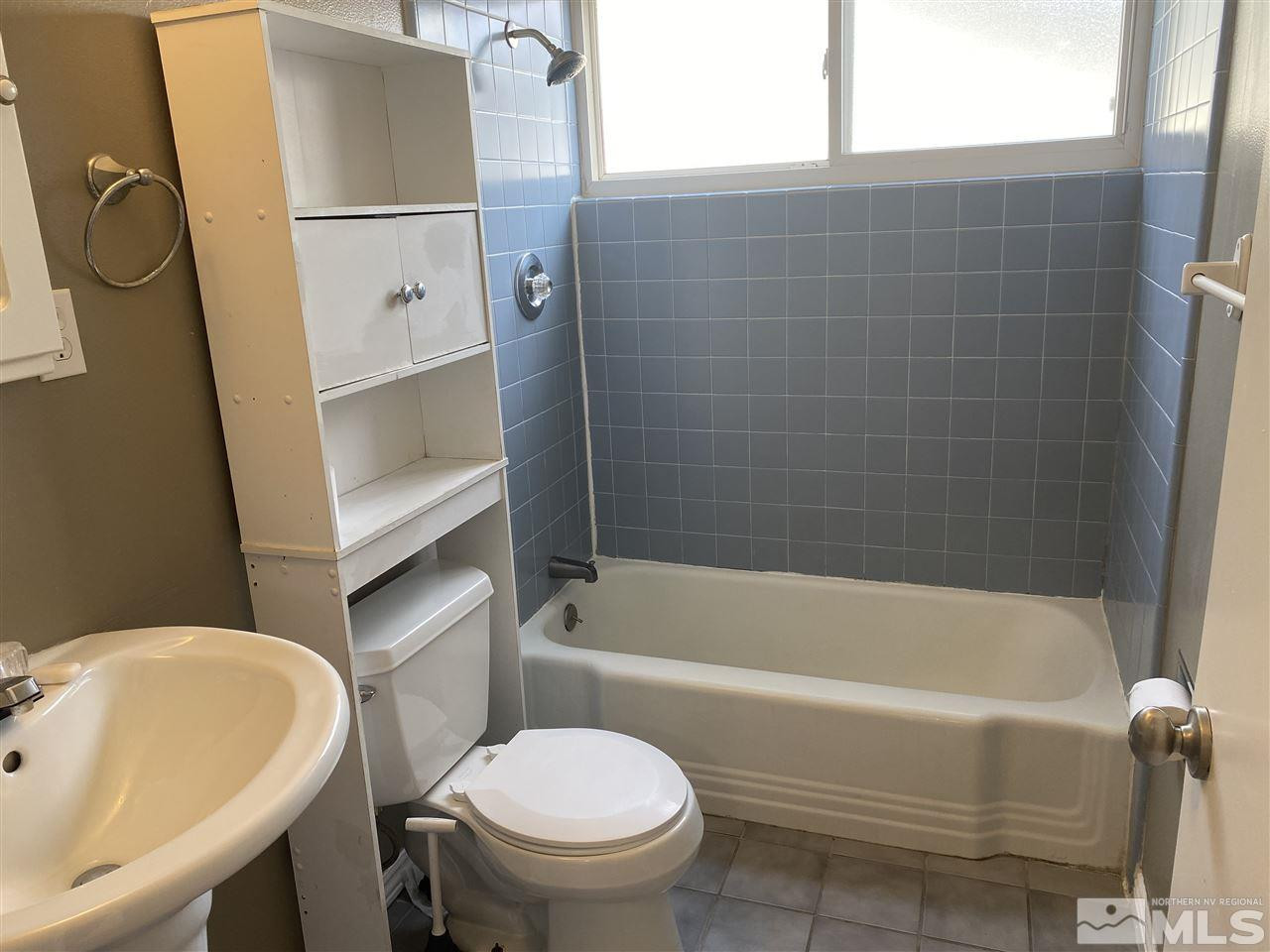 1165 Manhattan Street Reno, NV 89512 - Photo 6 of 14 a bathroom with a sink and a toilet
