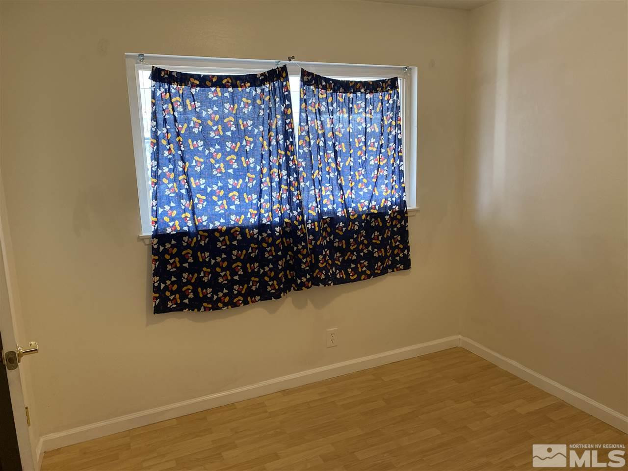 1165 Manhattan Street Reno, NV 89512 - Photo 8 of 14 a view of a room with wooden floor