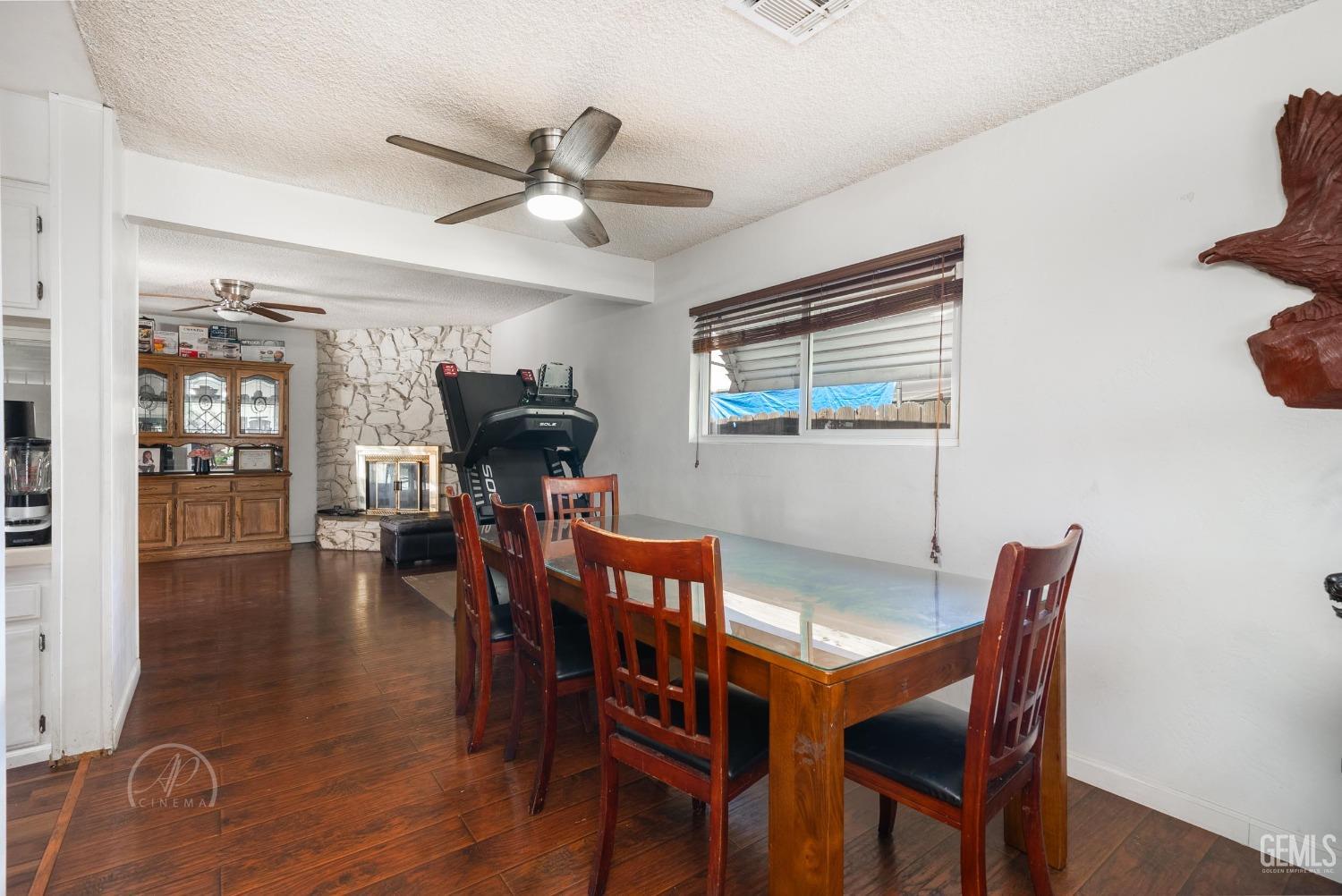 Undisclosed Address Bakersfield, CA 93307 - Photo 12 of 26 a view of a dining room with furniture window and wooden floor