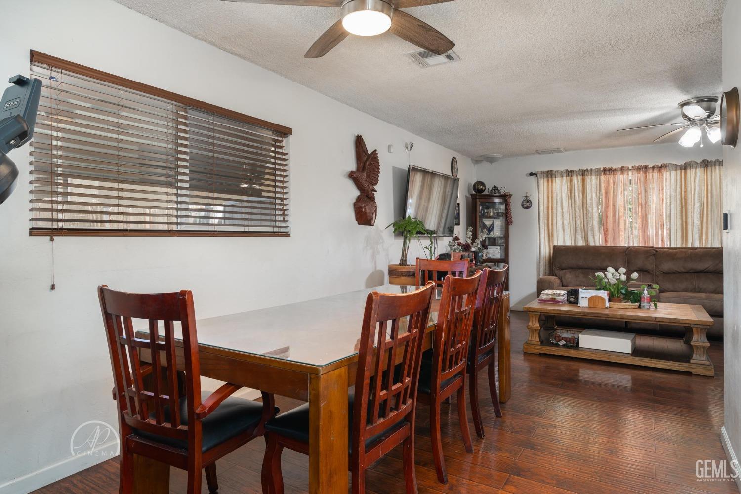 Undisclosed Address Bakersfield, CA 93307 - Photo 13 of 26 a view of a dining room with furniture and chandelier