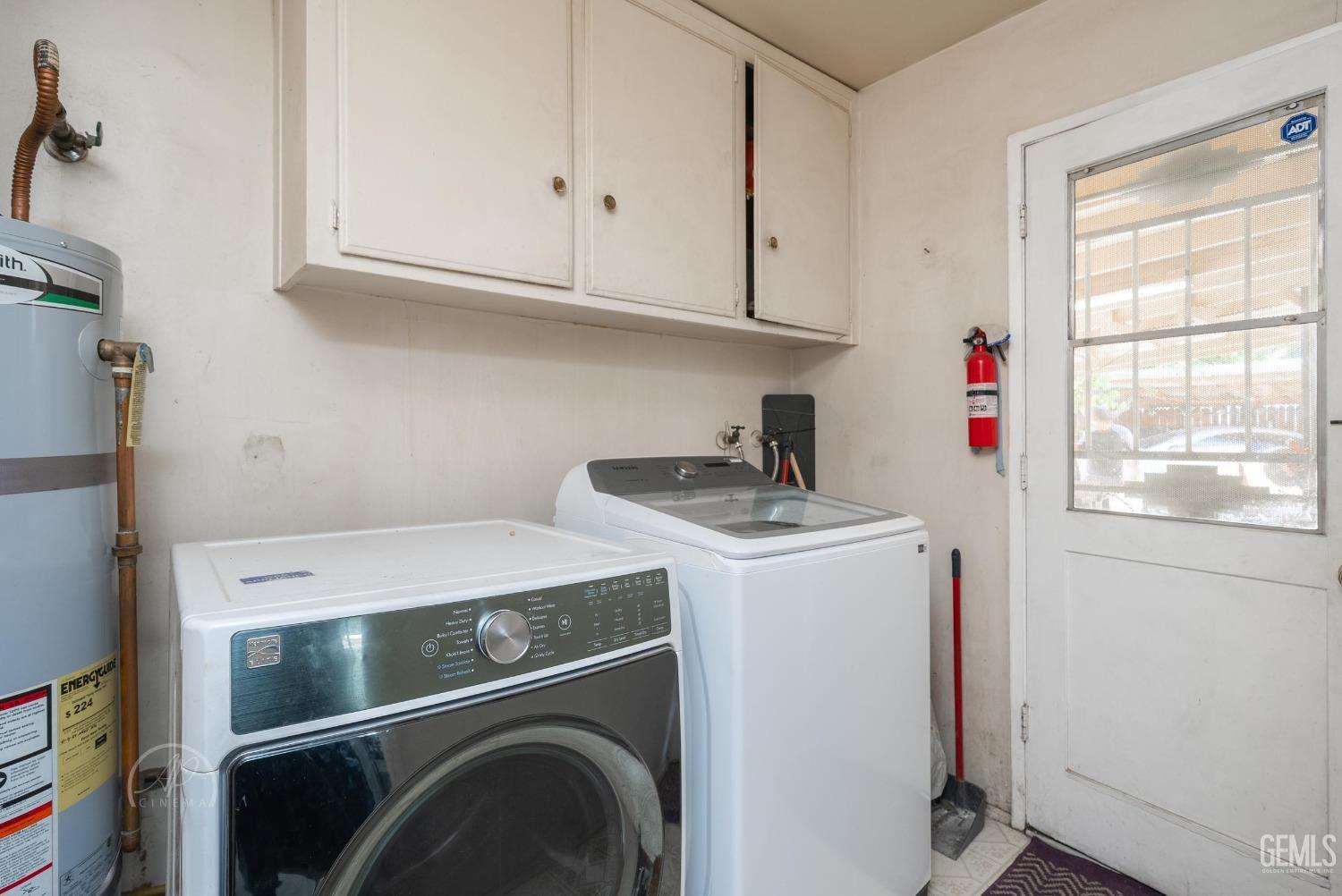 Undisclosed Address Bakersfield, CA 93307 - Photo 17 of 26 a utility room with dryer and washer