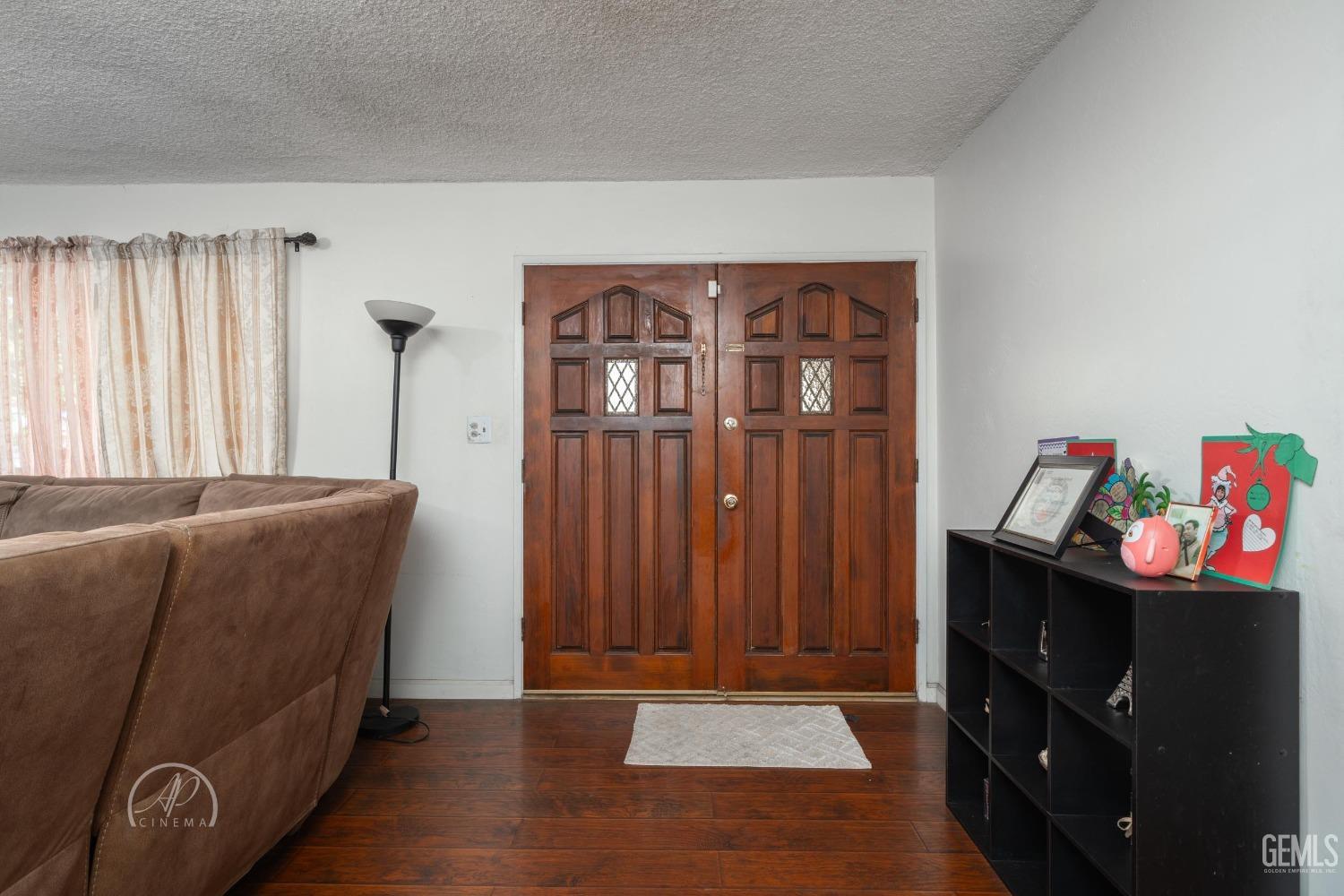 Undisclosed Address Bakersfield, CA 93307 - Photo 3 of 26 a living room with furniture and a window