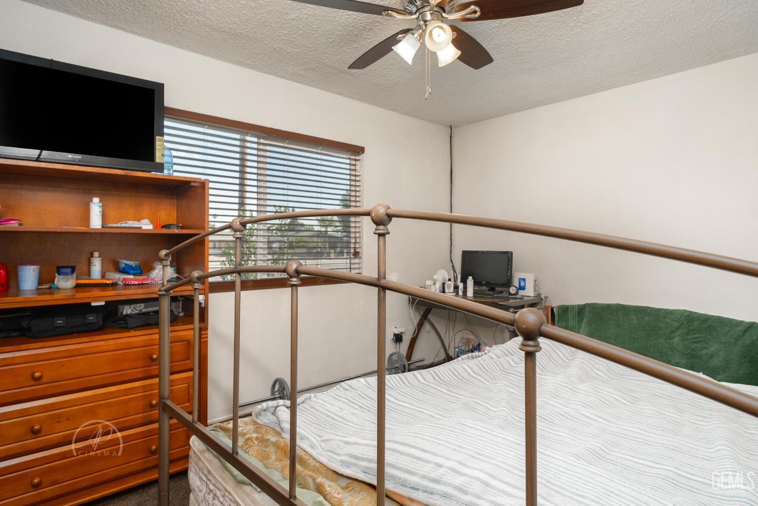 Undisclosed Address Bakersfield, CA 93307 - Photo 6 of 26 a kitchen with stainless steel appliances kitchen island granite countertop a stove and a microwave