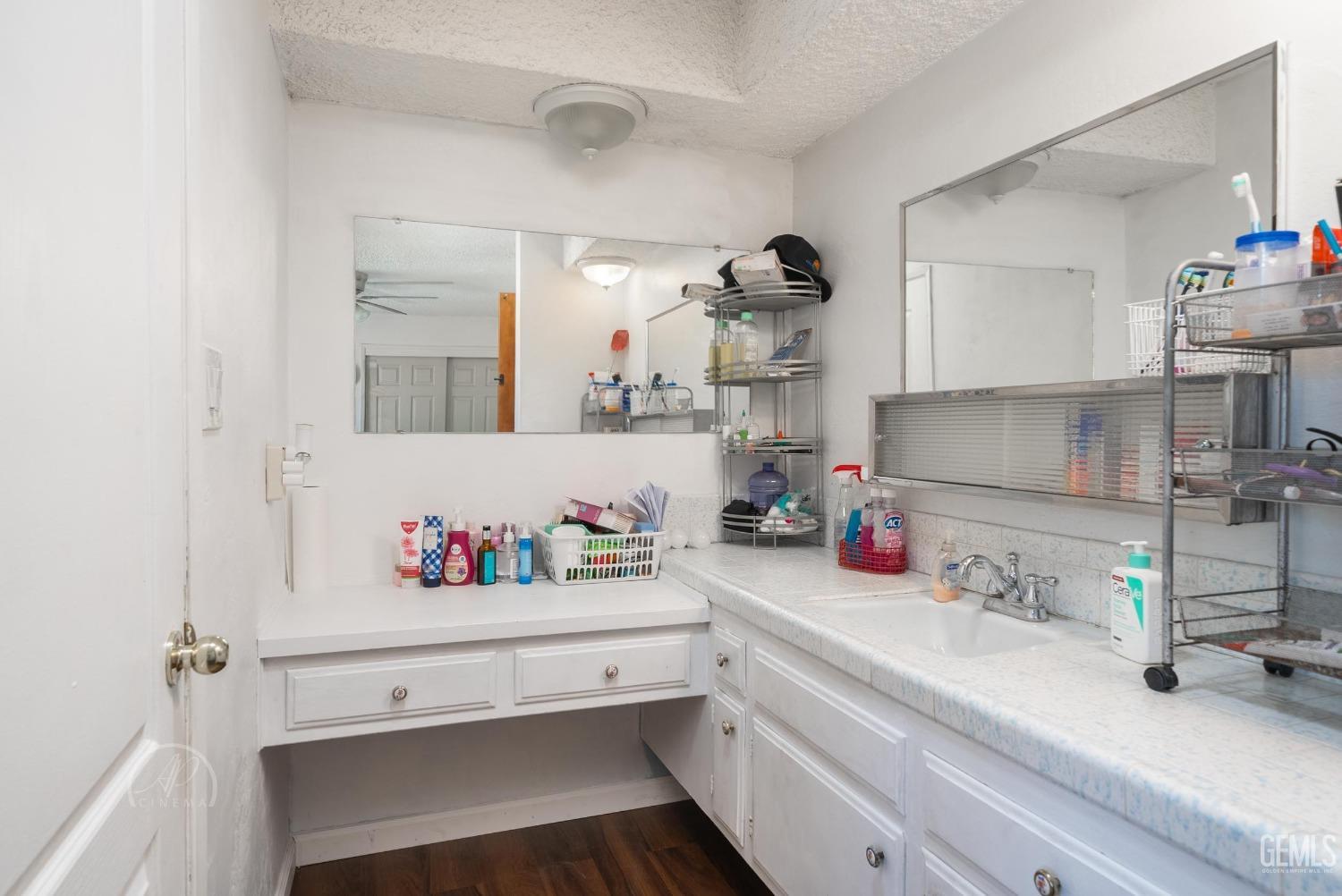 Undisclosed Address Bakersfield, CA 93307 - Photo 9 of 26 a kitchen with a sink cabinets and a window