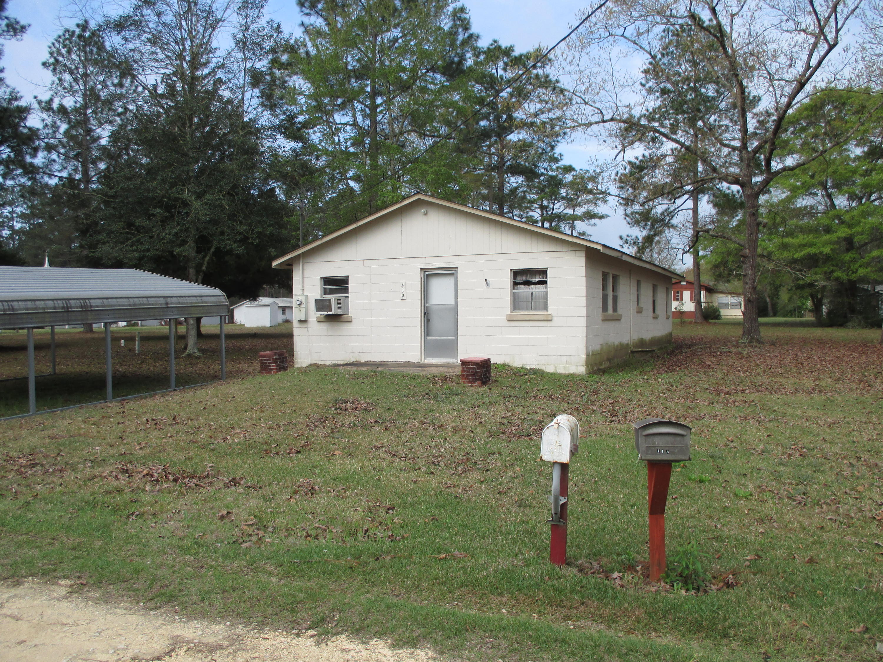 419 Christian Life Road DeFuniak Springs, FL 32433 - Photo 3 of 9 a view of a house with a yard and large tree