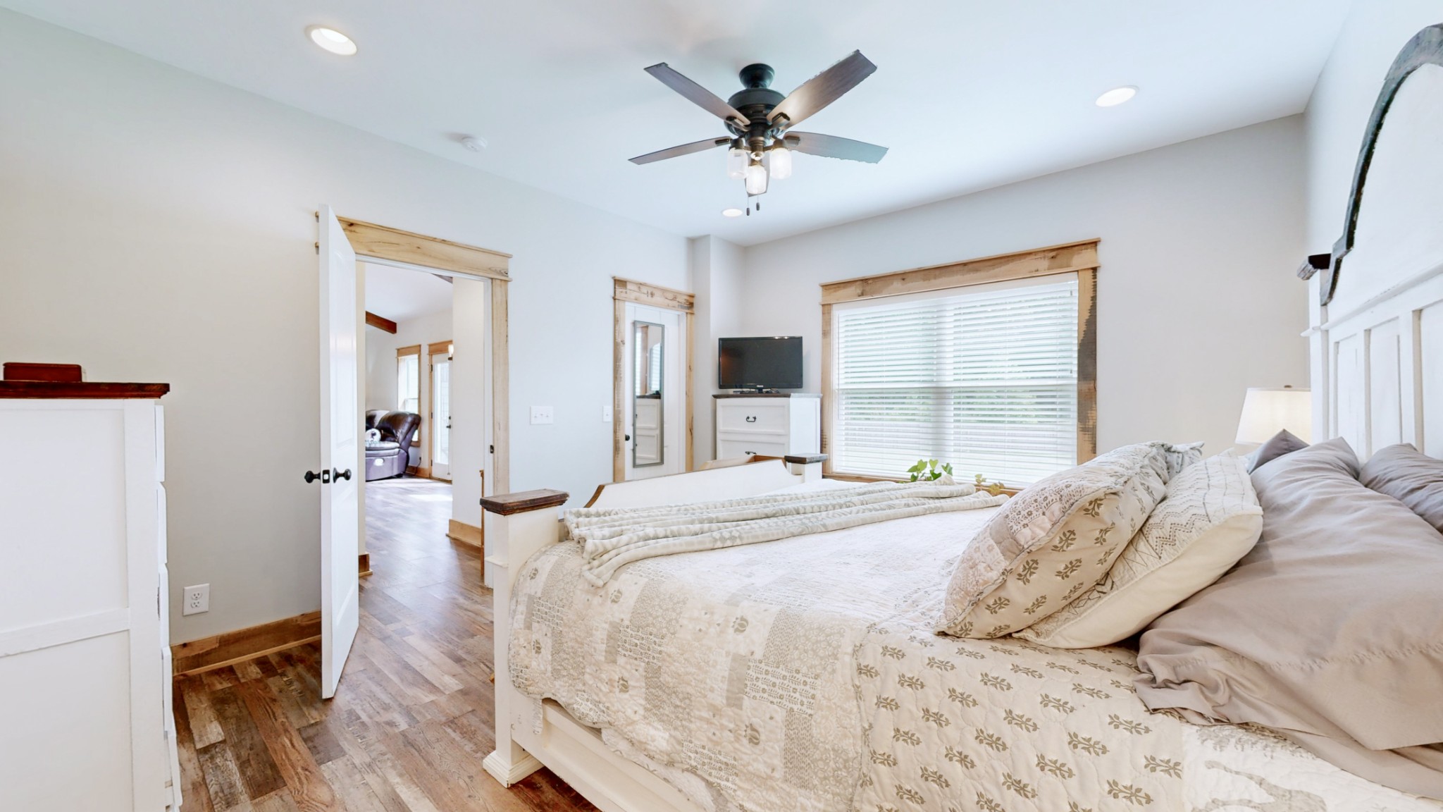 601 King Ridge Road Dowelltown, TN 37059 - Photo 24 of 49 a bedroom with a bed and a chandelier
