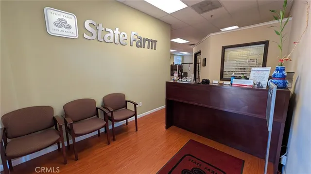a room with furniture and paintings on wall