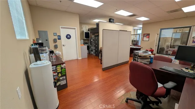 a view of a workspace with furniture and a livingroom