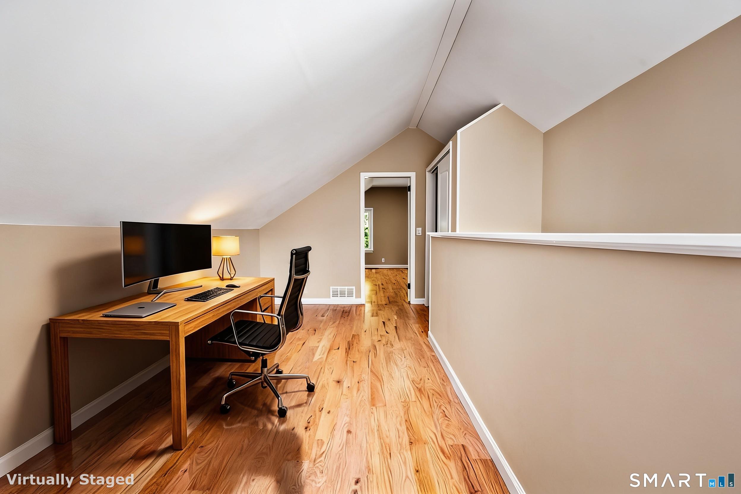 110 Minturn Road Bridgeport, CT 06606 - Photo 21 of 29 a view of a workspace with furniture and wooden floor