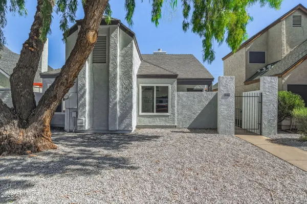 a view of a house with a tree