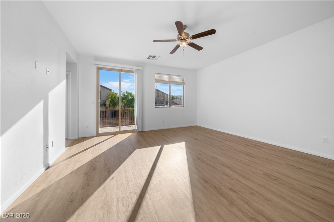 10059 Lady Apple Drive Las Vegas, NV 89148 - Photo 16 of 31 Empty room featuring wood finished floors and a ceiling fan