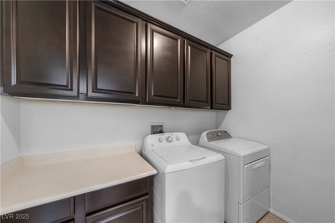 10059 Lady Apple Drive Las Vegas, NV 89148 - Photo 21 of 31 Laundry room with independent washer and dryer and cabinet space