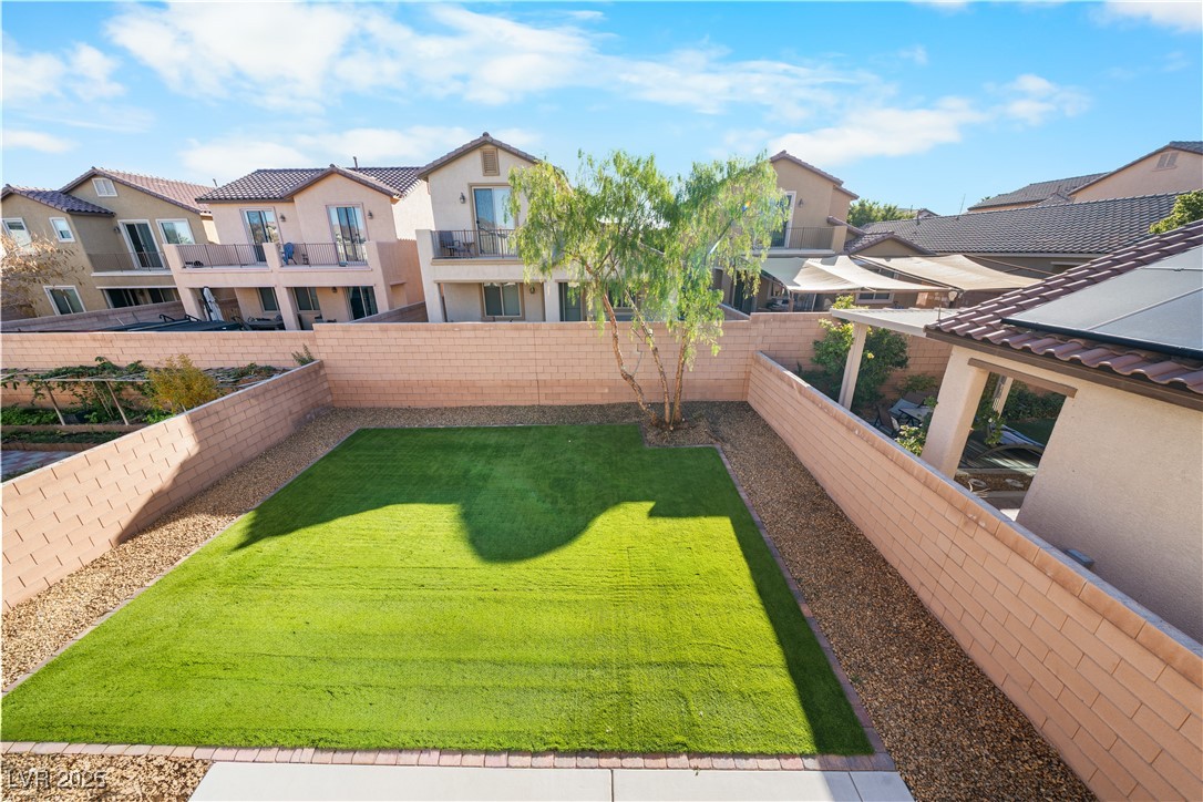 10059 Lady Apple Drive Las Vegas, NV 89148 - Photo 28 of 31 Fenced backyard with a residential view and a balcony