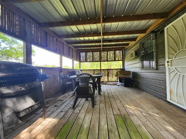 a view of a deck with wooden floor