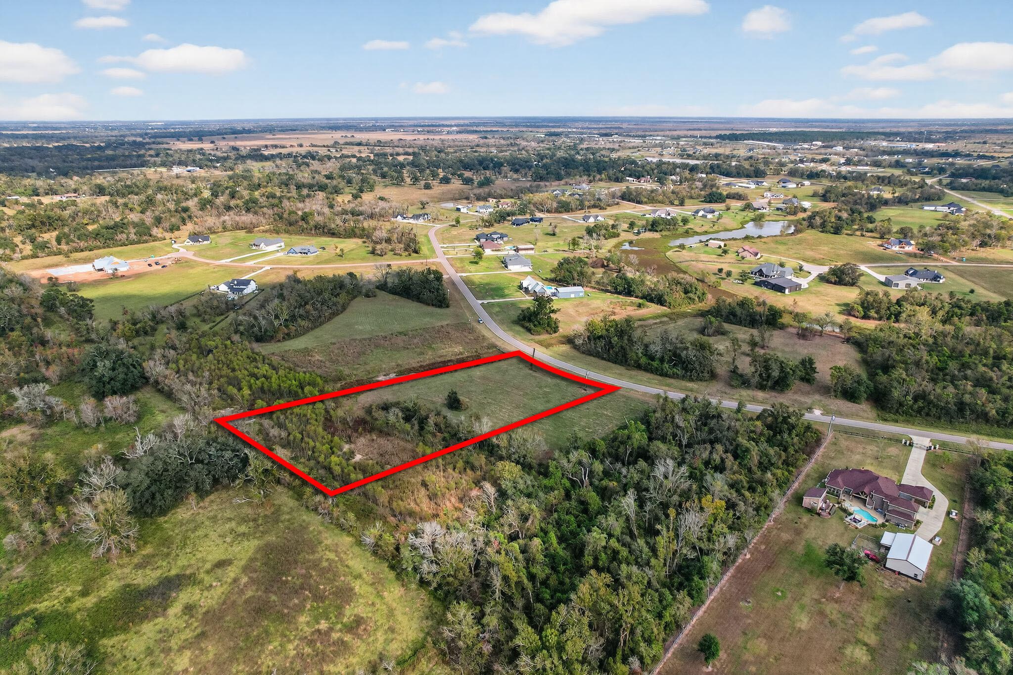 22810 Pittman Drive Angleton, TX 77515 - Photo 2 of 7 an aerial view of residential houses with outdoor space and swimming pool