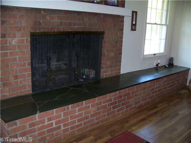2044 Chestnut Grove Road King, NC 27021 - Photo 9 of 9 Other. Wood Burning Fireplace in the den, and it has a thick slab of slate covering the tops of the brick. A Great feature of this home.