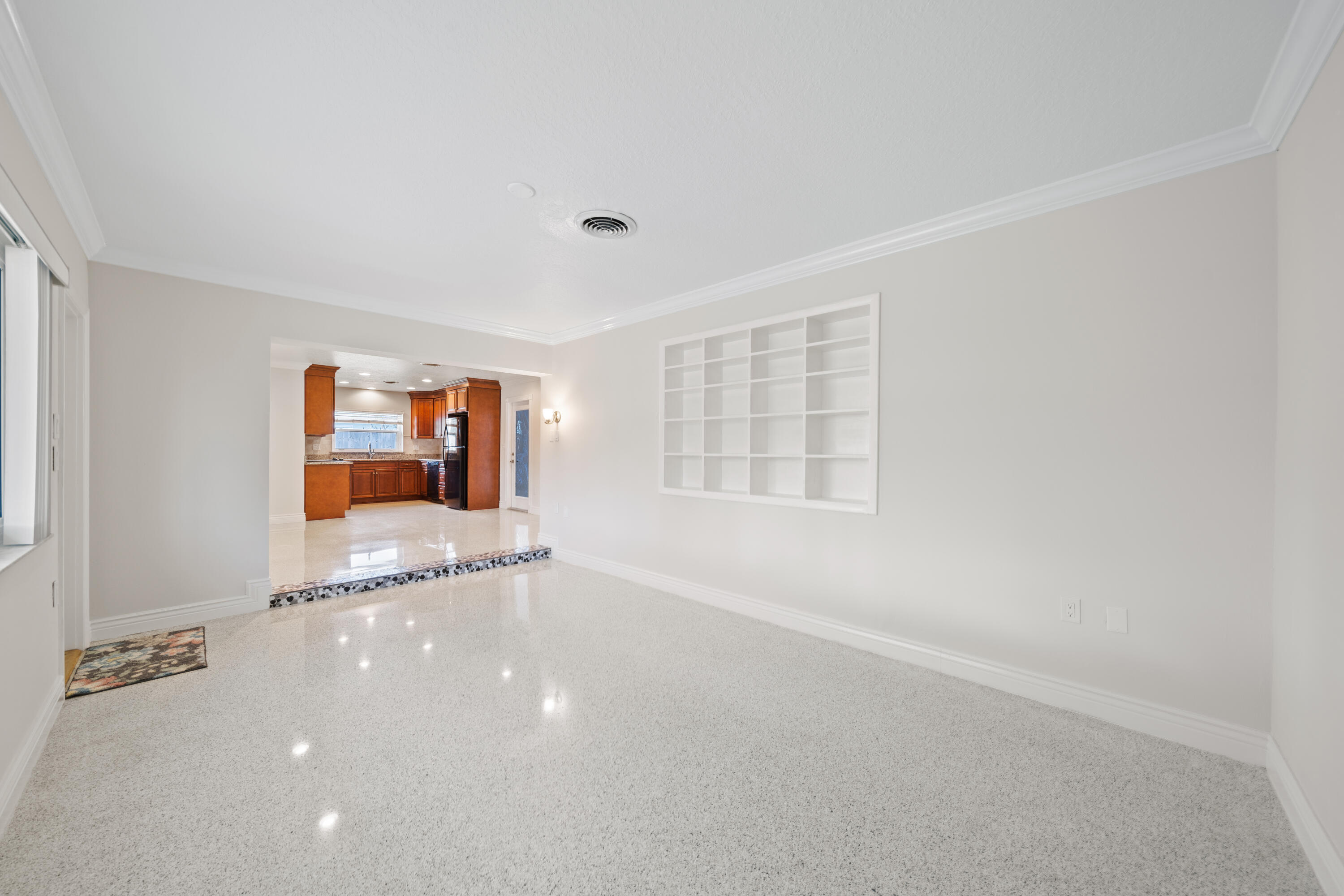 415 Rosedale Drive Satellite Beach, FL 32937 - Photo 20 of 52 an empty room with bookshelf and natural light