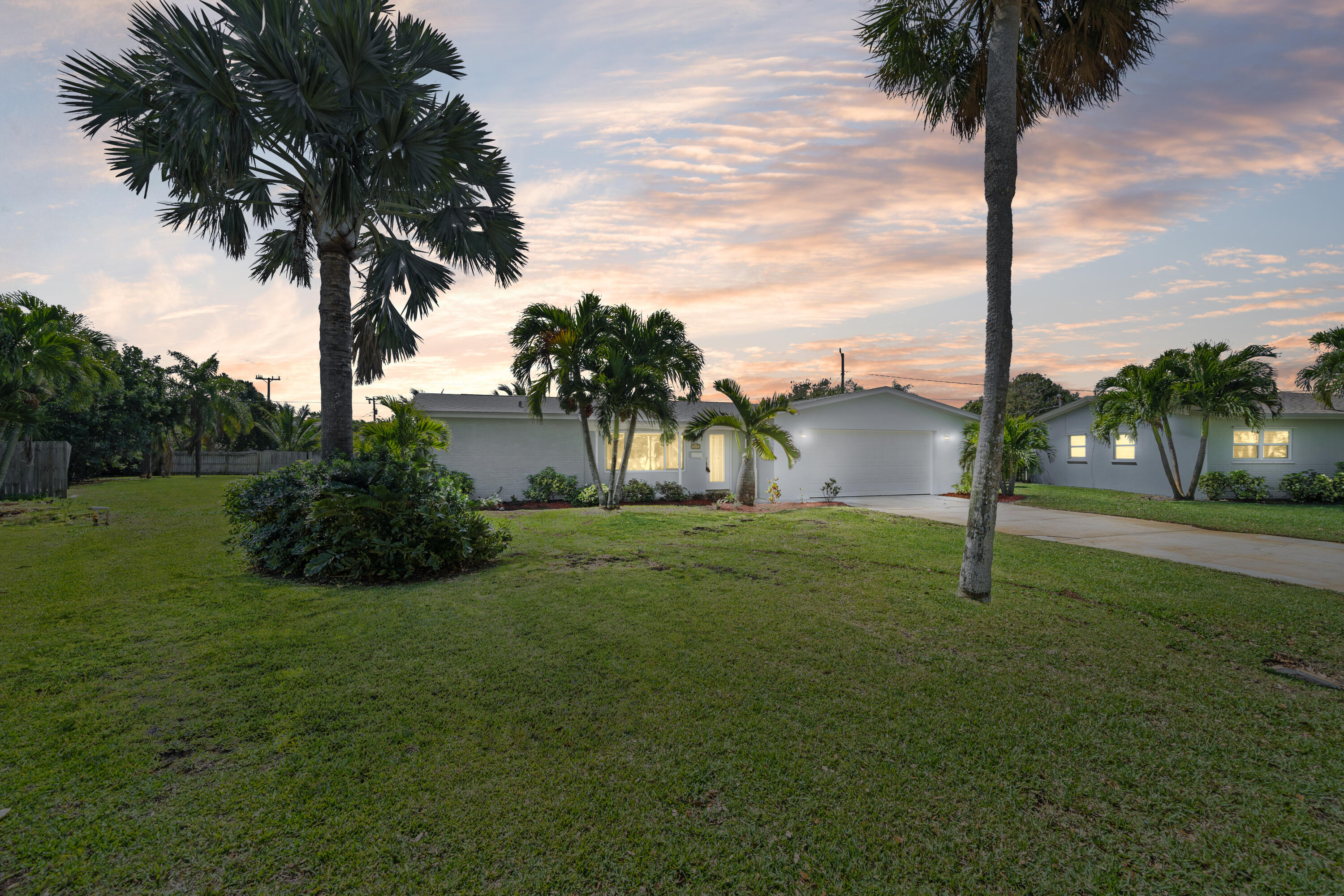 415 Rosedale Drive Satellite Beach, FL 32937 - Photo 2 of 52 a street sign on green field next to a road