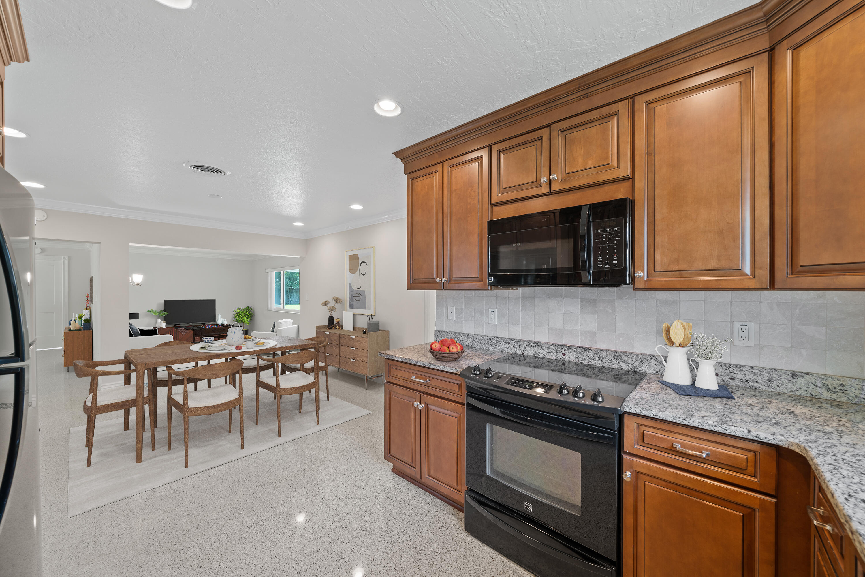 415 Rosedale Drive Satellite Beach, FL 32937 - Photo 22 of 52 a kitchen with stainless steel appliances granite countertop a stove top oven a sink dishwasher a dining table and chairs with wooden floor