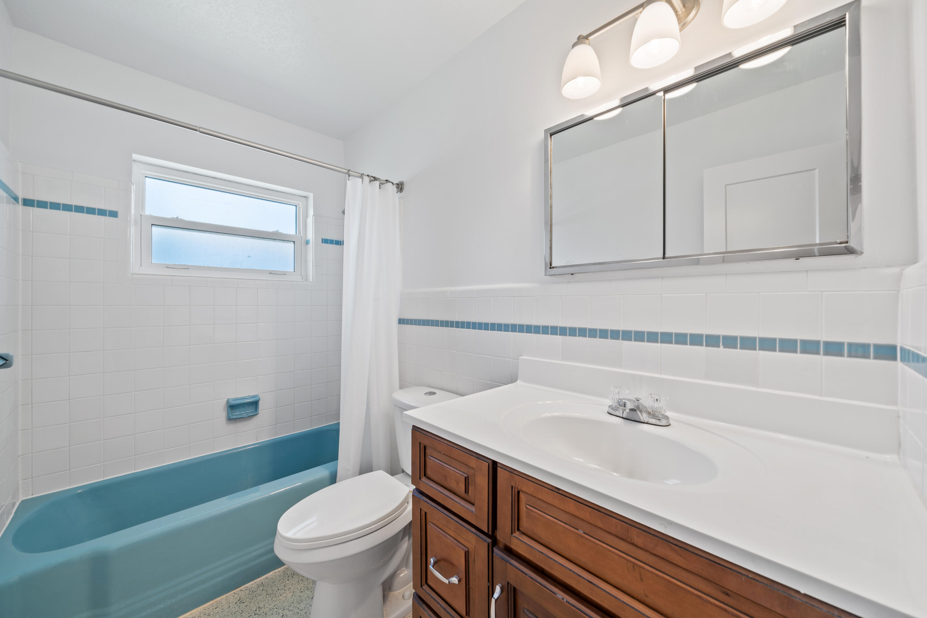 415 Rosedale Drive Satellite Beach, FL 32937 - Photo 26 of 52 a bathroom with a sink a toilet and a mirror