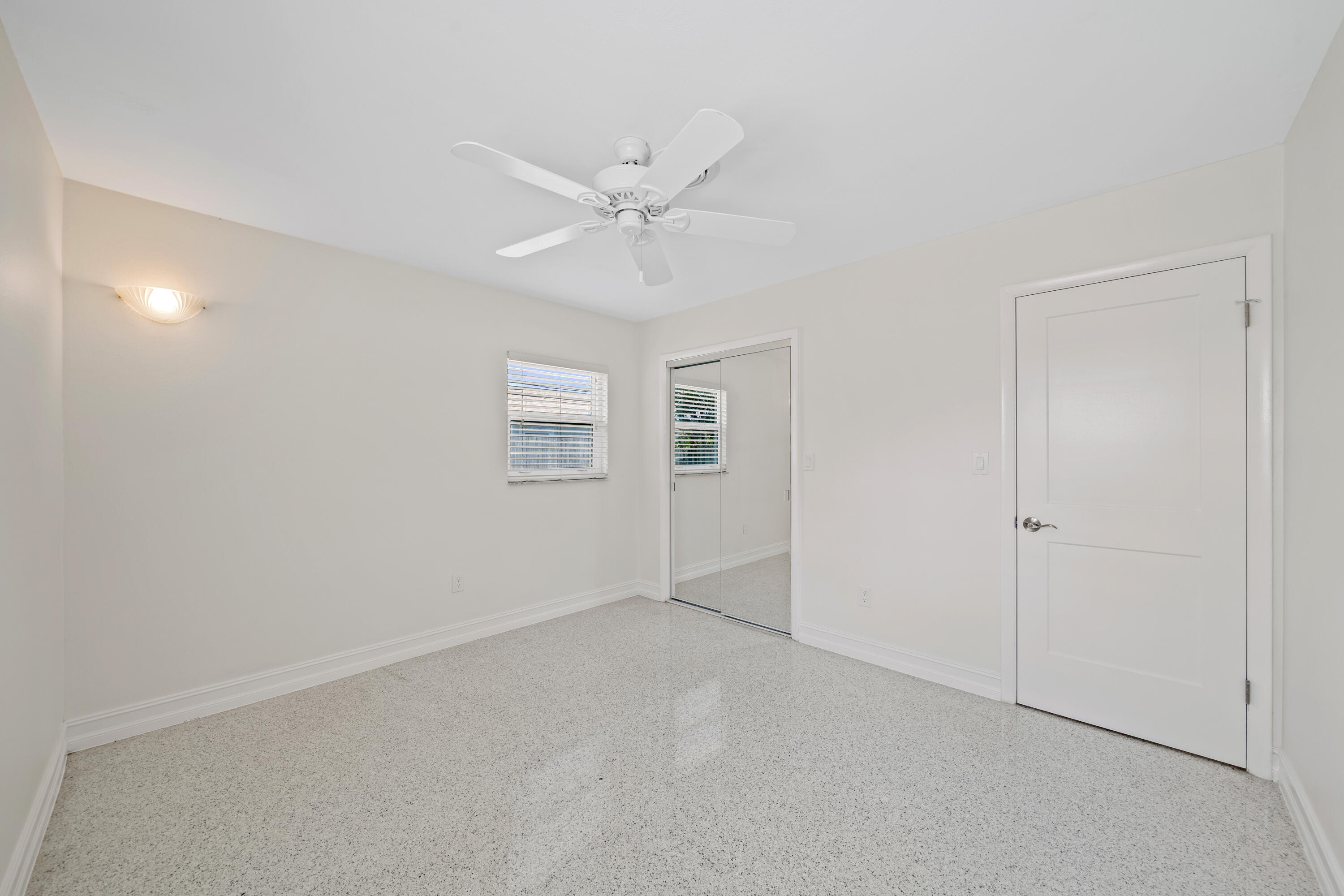 415 Rosedale Drive Satellite Beach, FL 32937 - Photo 28 of 52 an empty room with a ceiling fan and a window